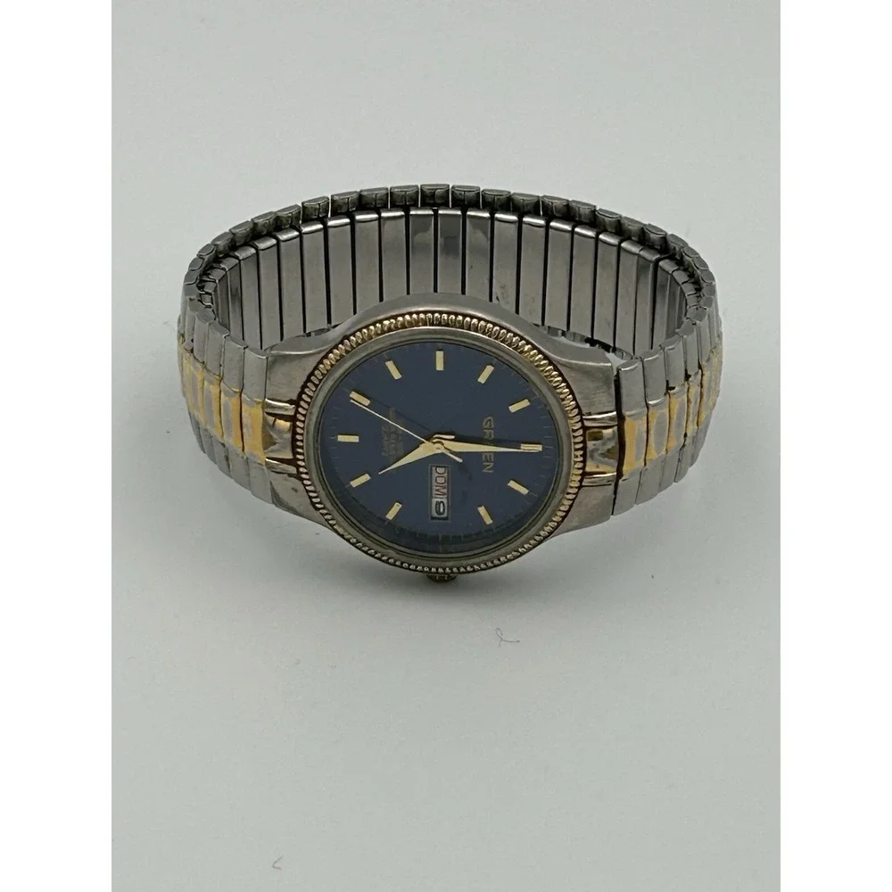 Gruen men's watch GU1022 Blue Face Stainless Steel And Gold Stretch Band Read